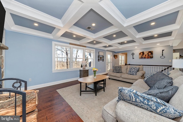 living area featuring beam ceiling, visible vents, and a wealth of natural light