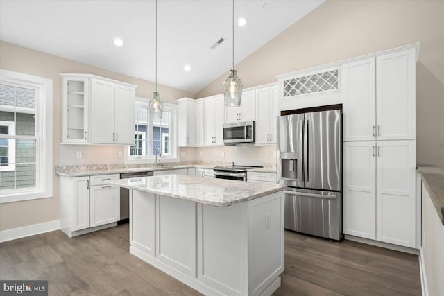 kitchen featuring stainless steel appliances, visible vents, dark wood-type flooring, and white cabinetry