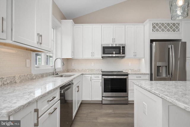 kitchen with dark wood finished floors, lofted ceiling, stainless steel appliances, white cabinetry, and a sink