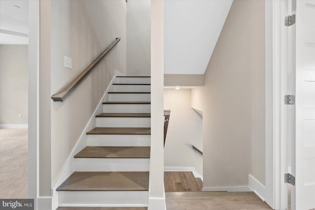 stairs featuring baseboards