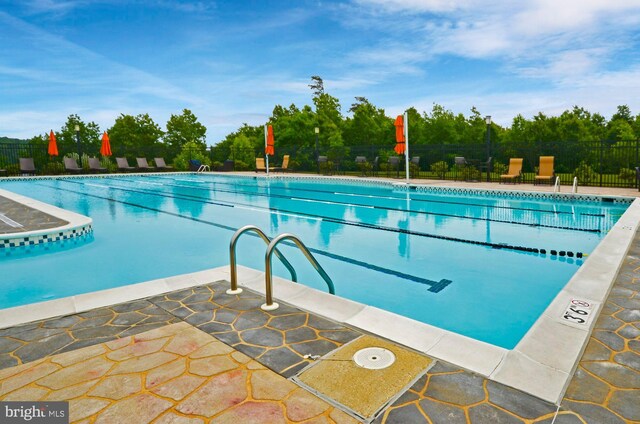 community pool featuring fence
