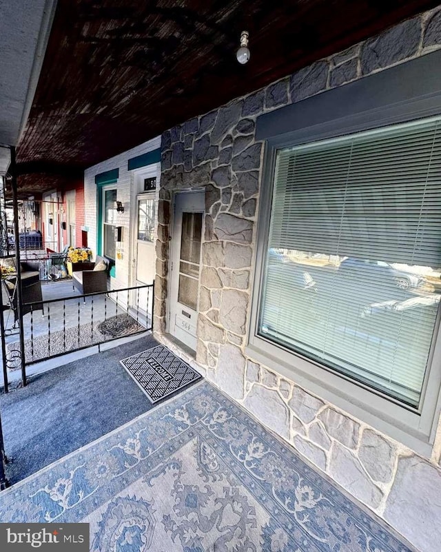 doorway to property with a porch