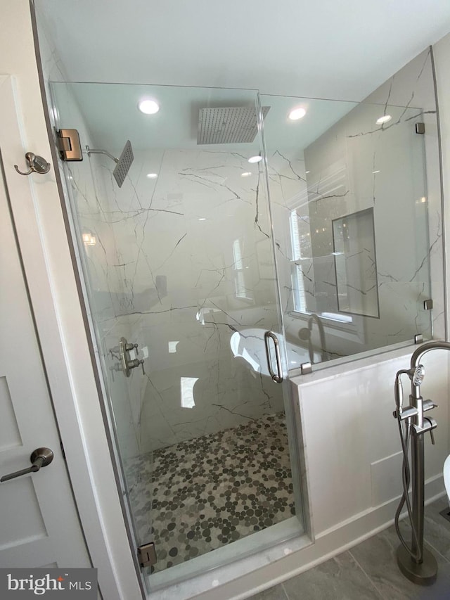 full bath with recessed lighting and a marble finish shower