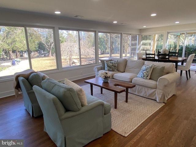 sunroom with a healthy amount of sunlight and visible vents