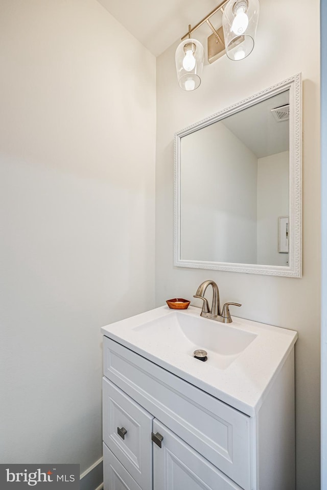 bathroom with vanity and visible vents