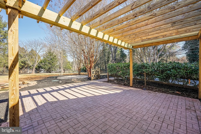 view of patio featuring fence and a pergola