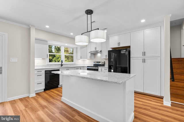 kitchen with black appliances, a kitchen island, light wood-style flooring, white cabinetry, and a sink