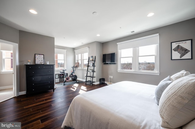 bedroom with recessed lighting, visible vents, baseboards, and dark wood-style floors