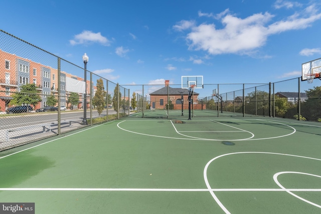 view of sport court featuring community basketball court and fence