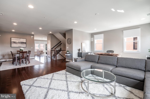 living room with stairway, recessed lighting, baseboards, and wood-type flooring