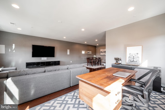 living room with wood finished floors, recessed lighting, and visible vents