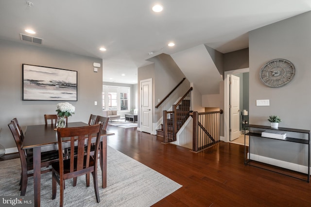 dining area with visible vents, recessed lighting, wood-type flooring, baseboards, and stairs