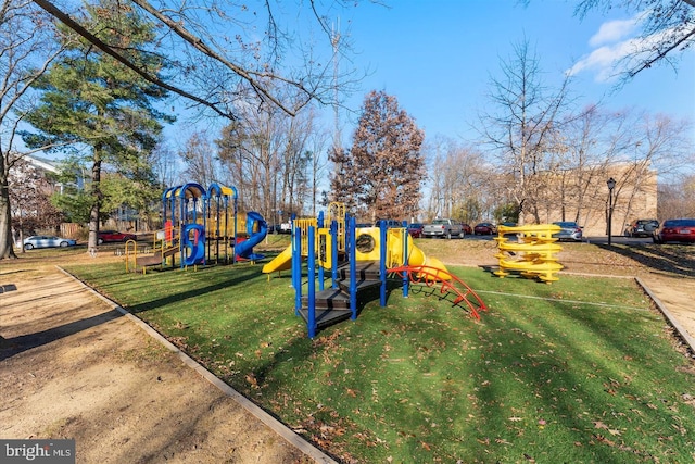 community jungle gym with a yard