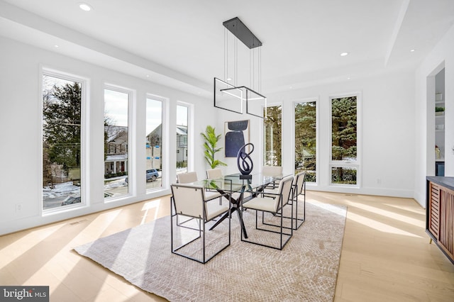 dining area featuring recessed lighting, baseboards, and light wood finished floors