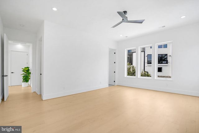 unfurnished room with light wood-style floors, ceiling fan, baseboards, and recessed lighting