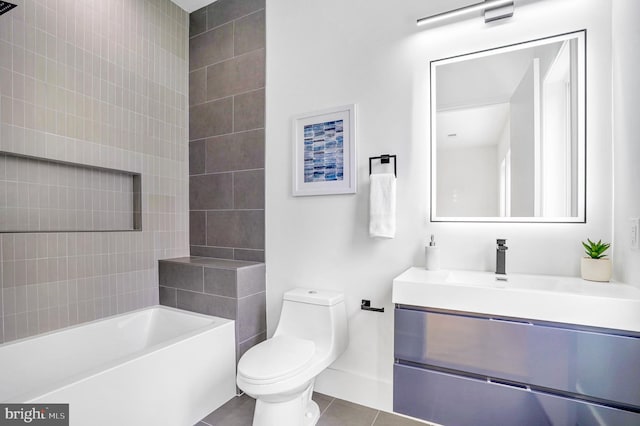 full bath with a tub, vanity, toilet, and tile patterned floors