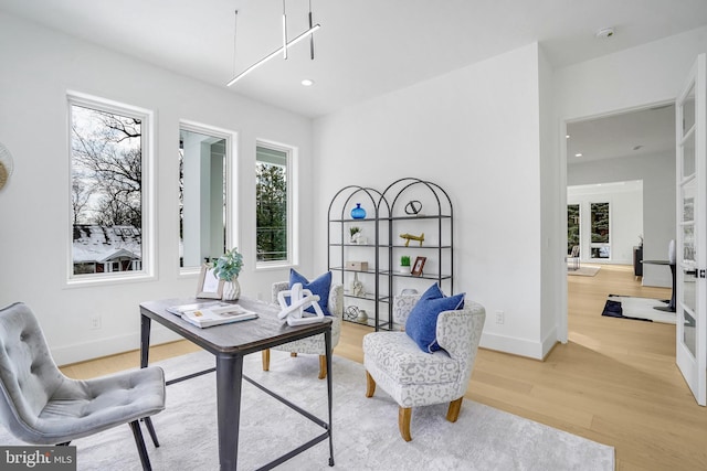 home office featuring recessed lighting, french doors, light wood-style flooring, and baseboards