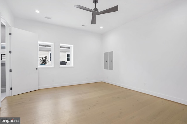 empty room with ceiling fan, light wood-type flooring, visible vents, and recessed lighting