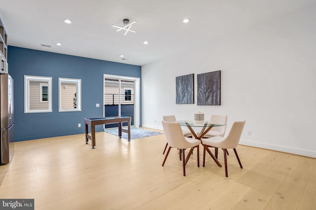 dining space with light wood-type flooring, visible vents, baseboards, and recessed lighting