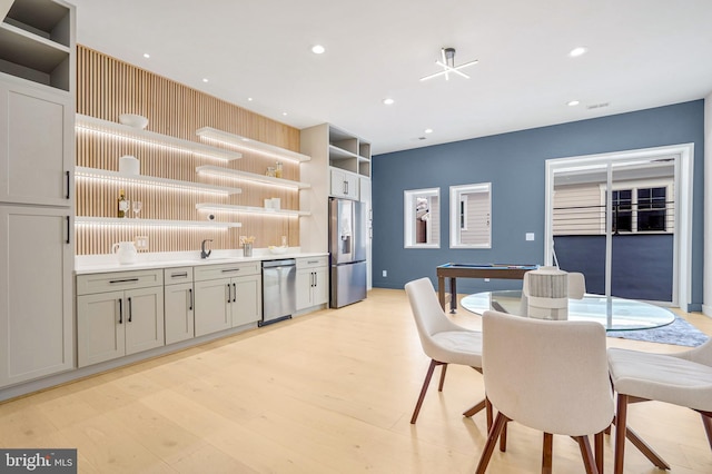 dining room featuring light wood-style flooring and recessed lighting