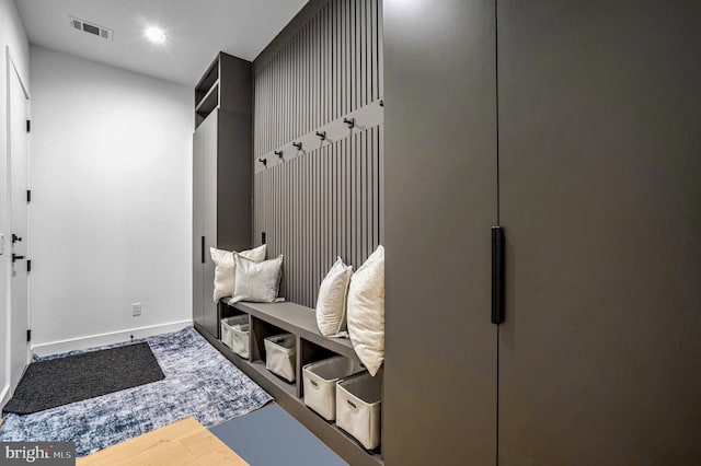 mudroom featuring baseboards, visible vents, and recessed lighting