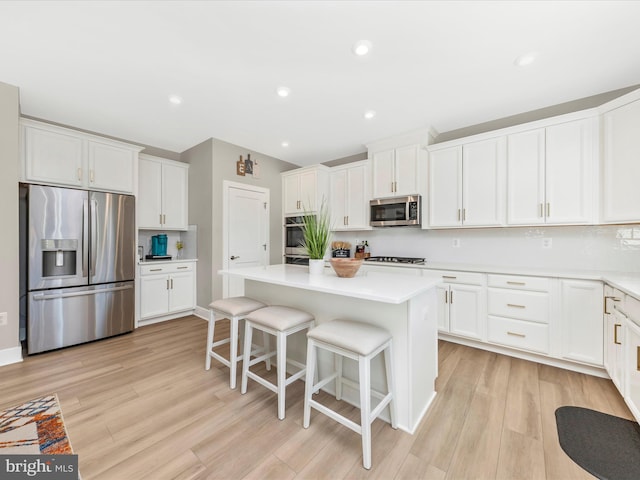 kitchen with stainless steel appliances and white cabinetry