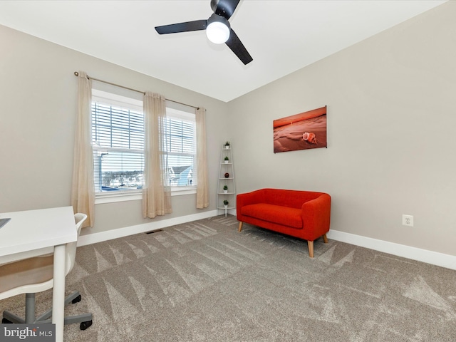 living area with ceiling fan, carpet floors, visible vents, and baseboards