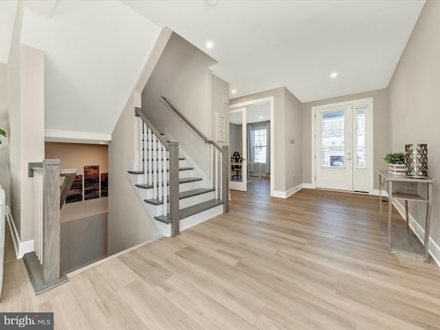 foyer with stairs, baseboards, wood finished floors, and recessed lighting