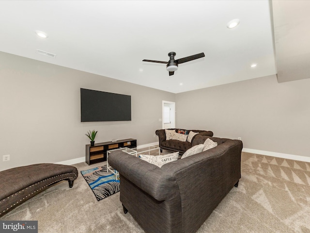 carpeted living room with baseboards, visible vents, and recessed lighting