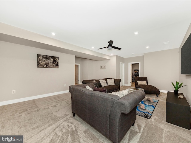 carpeted living area featuring baseboards, a ceiling fan, and recessed lighting