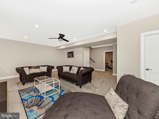 living room featuring a ceiling fan, recessed lighting, light carpet, and baseboards