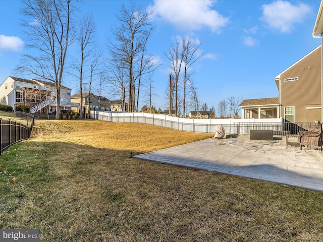 view of yard with a patio area and a fenced backyard