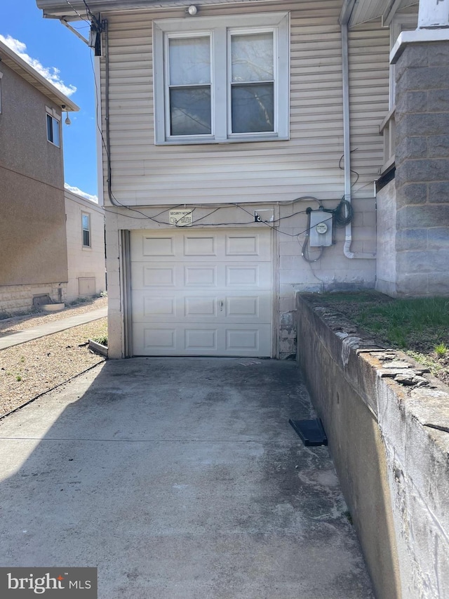 garage featuring driveway