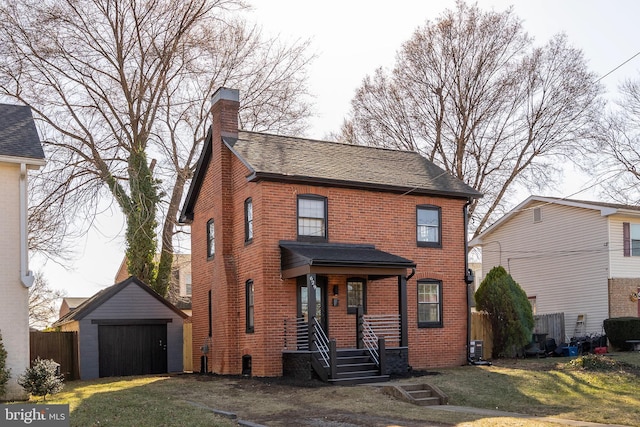 view of front facade with a garage, a chimney, an outdoor structure, a front lawn, and brick siding