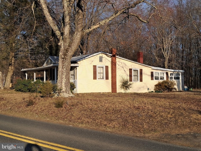 view of property exterior with a chimney