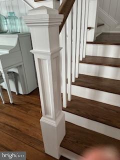 staircase featuring wood finished floors