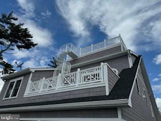 view of side of property featuring a balcony