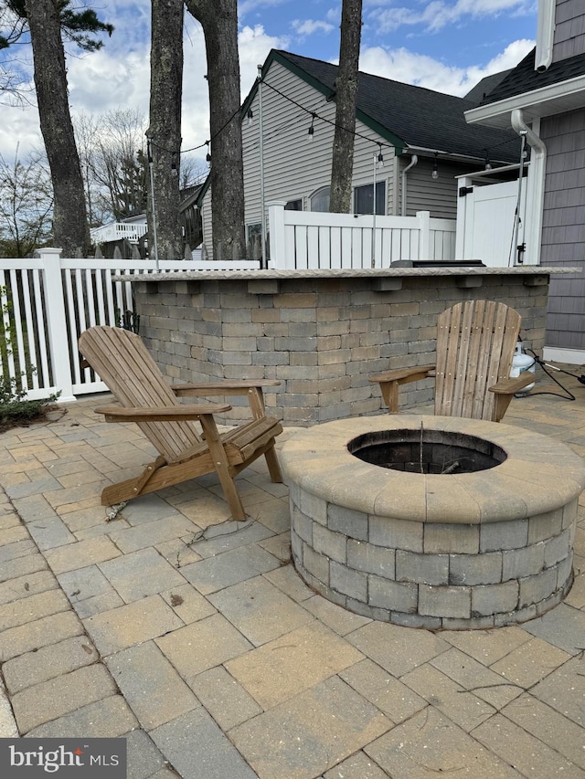 view of patio featuring an outdoor fire pit