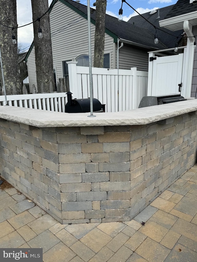 view of patio / terrace featuring fence