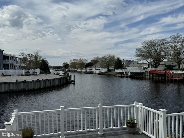 dock area with a water view