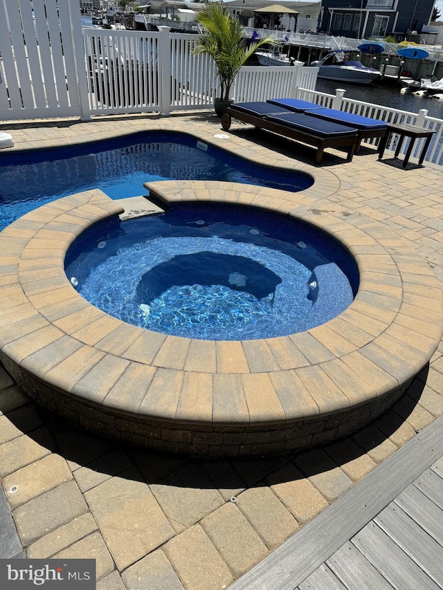 outdoor pool with an in ground hot tub