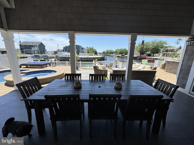 dining room featuring a water view