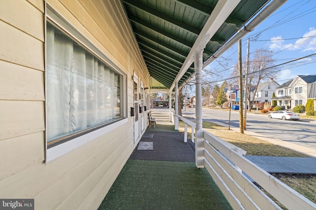 view of patio / terrace featuring a residential view and covered porch