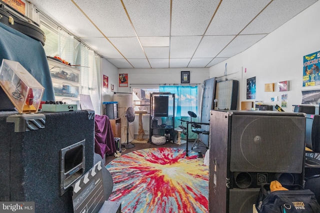 home office with a paneled ceiling