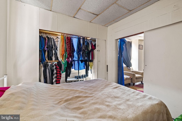 bedroom featuring a drop ceiling