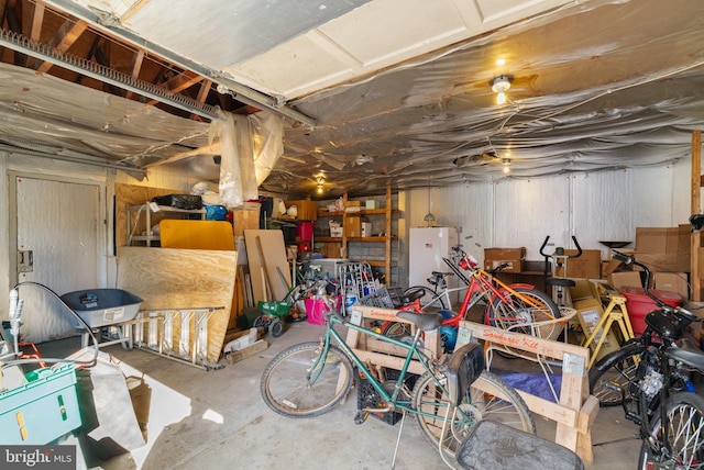 unfinished below grade area with freestanding refrigerator