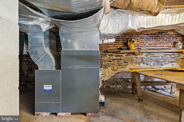 utility room featuring heating unit