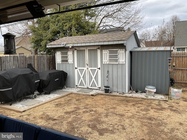 view of shed featuring a fenced backyard