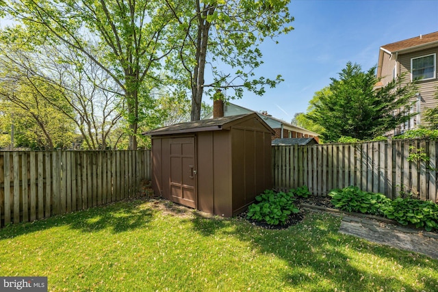view of shed with a fenced backyard