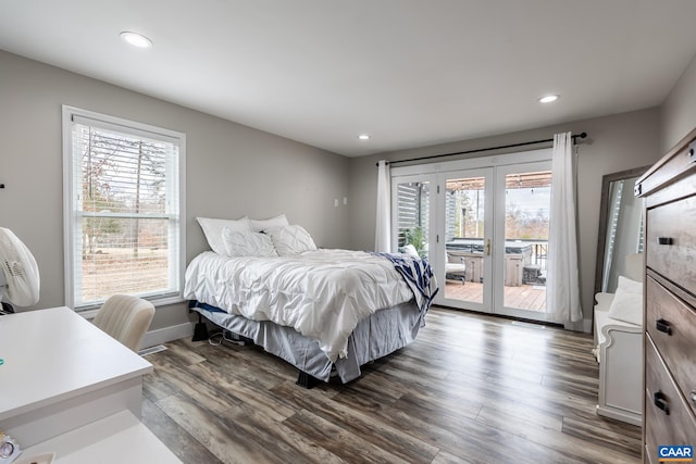 bedroom with access to exterior, dark wood-style floors, and recessed lighting